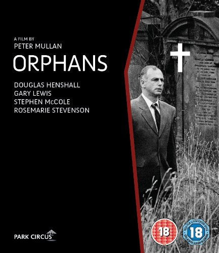 Blu-ray cover for Orphans featuring a man in a suit standing by a gravestone.