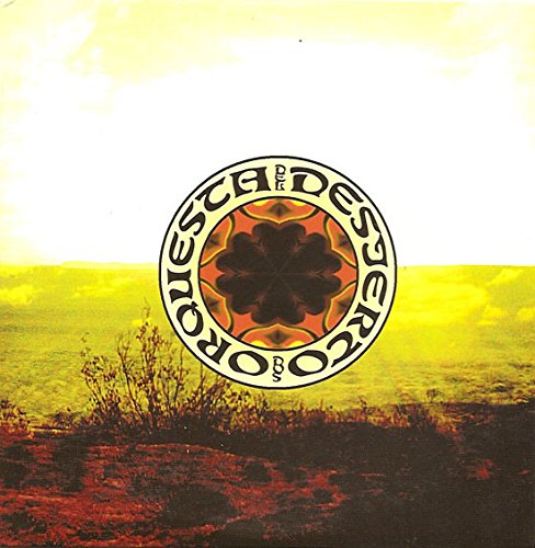 CD cover with a circular design over a desert landscape.