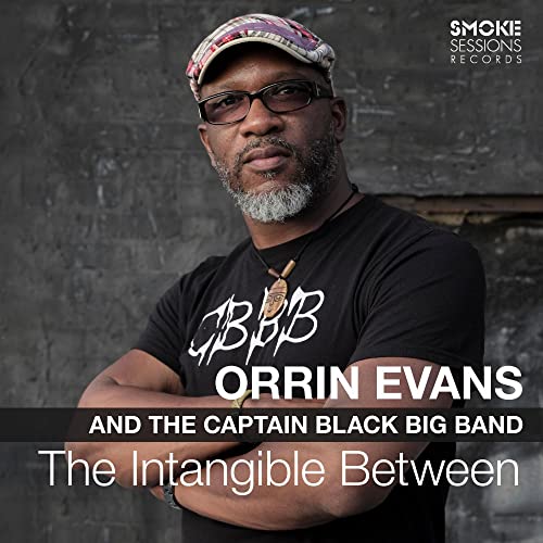 CD cover featuring Orrin Evans, a Black man wearing a cap and glasses.