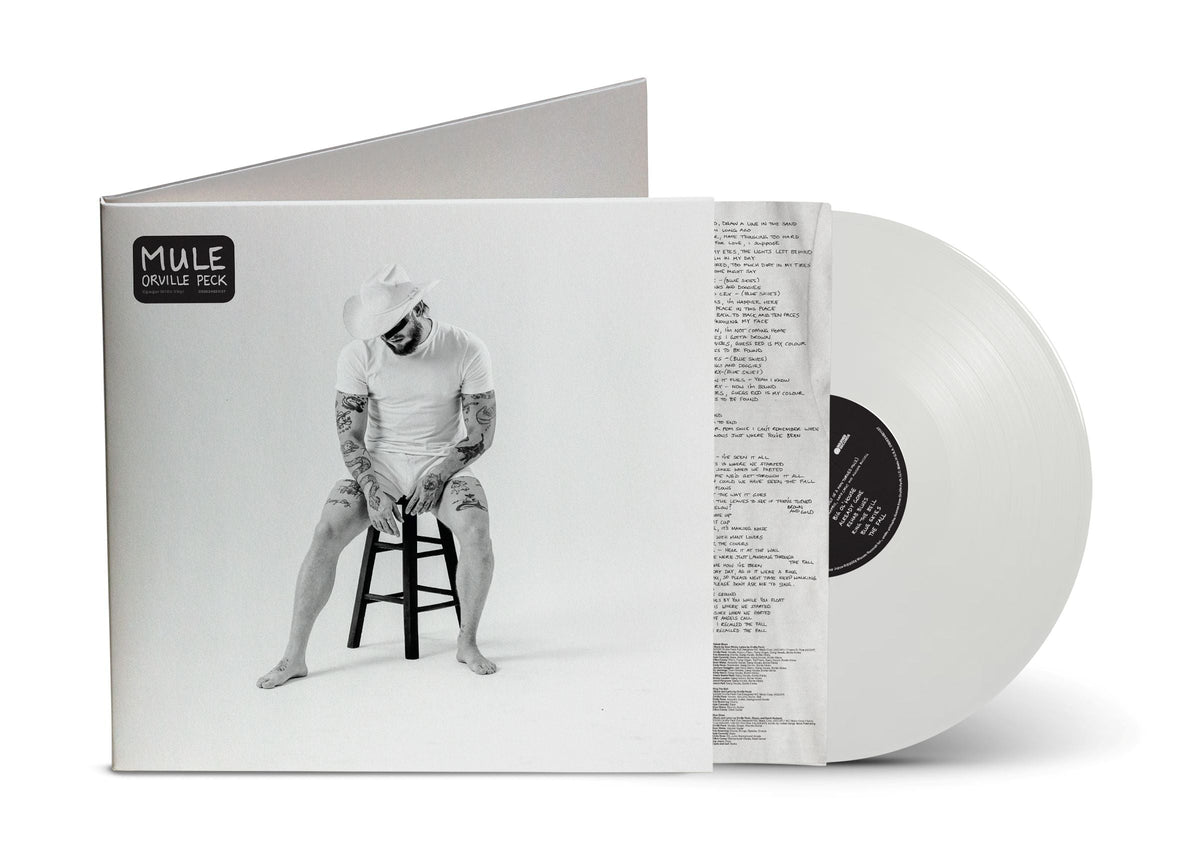 White vinyl record of Orville Peck’s “Mule” with a cowboy portrait.