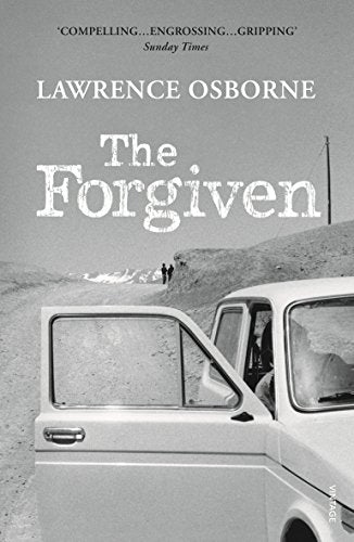 "The Forgiven" book cover featuring a black and white image of a van.