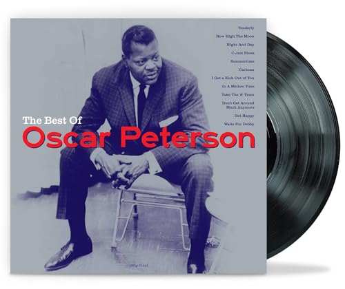 Oscar Peterson album cover and vinyl record, portrait of a man.