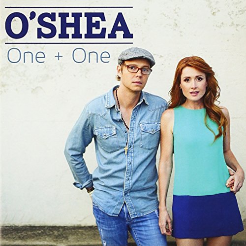"Album cover featuring a man and woman standing together against a white wall."
