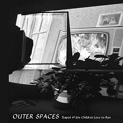 Black and white vinyl record cover with a vintage television image.