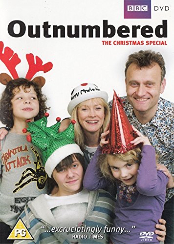 DVD cover featuring a family of five wearing Christmas hats and festive accessories.