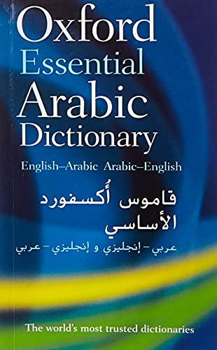 Dictionary with English and Arabic text, likely a compact rectangular book with a plain cover.