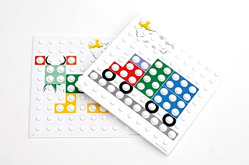 Two Numicon baseboard overlays featuring colorful shapes of a truck and a cow.