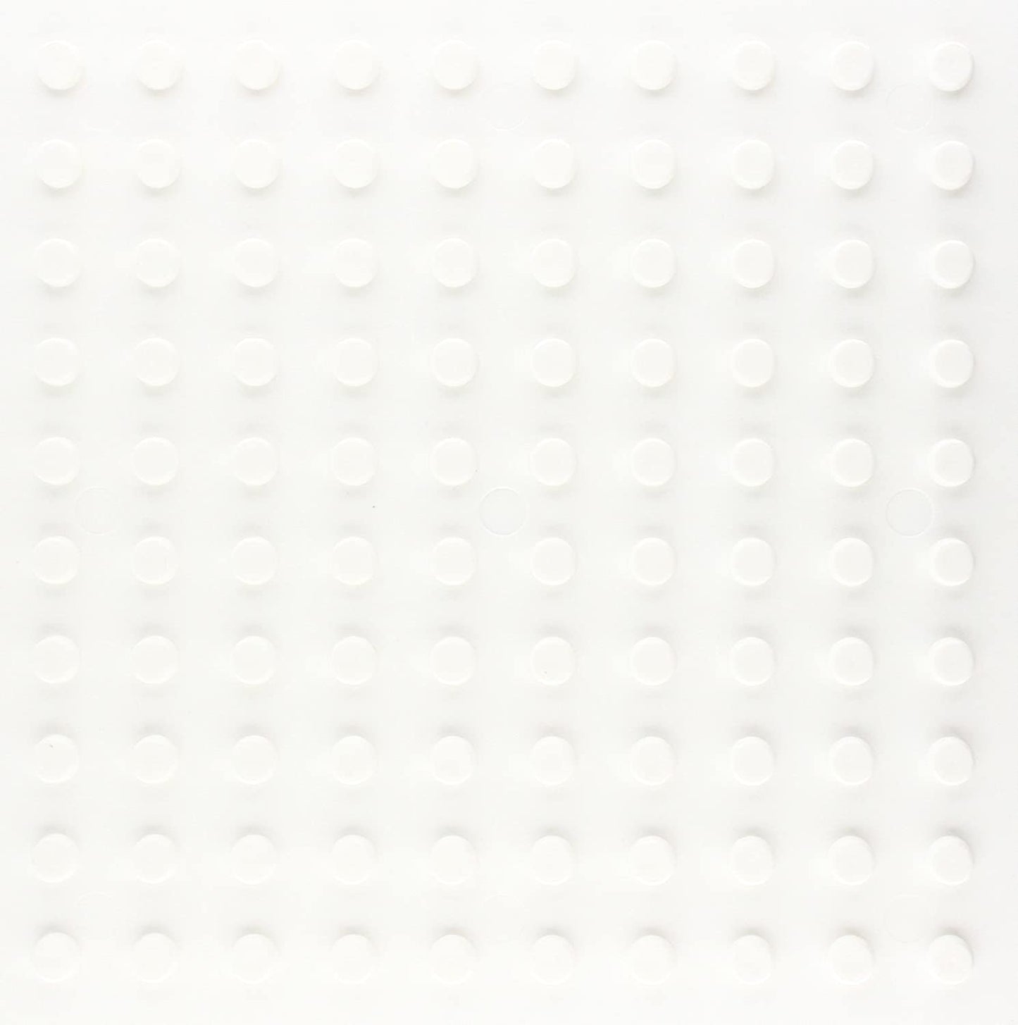 White square grid with 100 raised circular pegs, evenly spaced, on a flat surface.