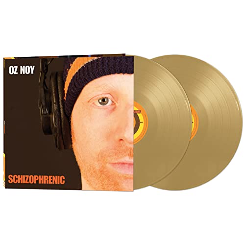 Oz Noy Schizoprenic album cover with two gold vinyl records displayed next to it.