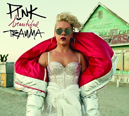 P!nk album cover: singer in silver and red, rural gas station backdrop.