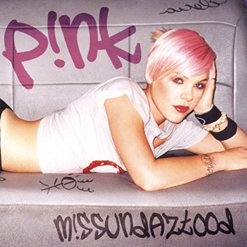 P!nk album cover: pink-haired singer reclining on a textured surface.