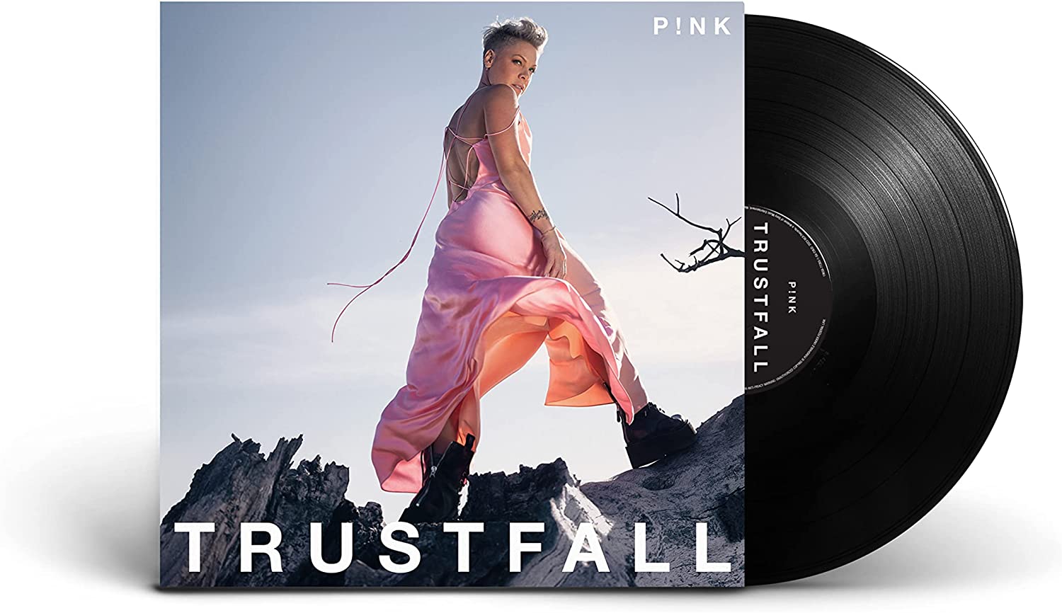 "Black vinyl record with cover art featuring a woman in a pink dress."