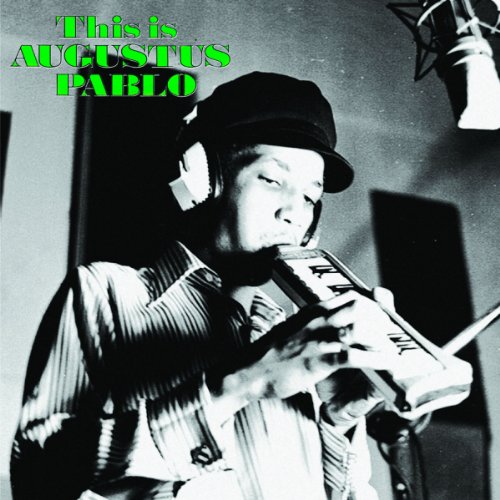 Black and white portrait of Augustus Pablo playing a melodica.