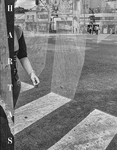 Book cover with fragmented image of a street scene and a hand.