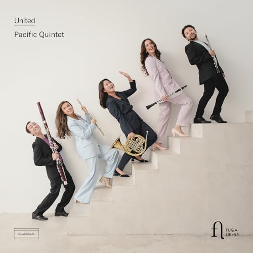 Pacific Quintet members with wind instruments posed on white stairs.