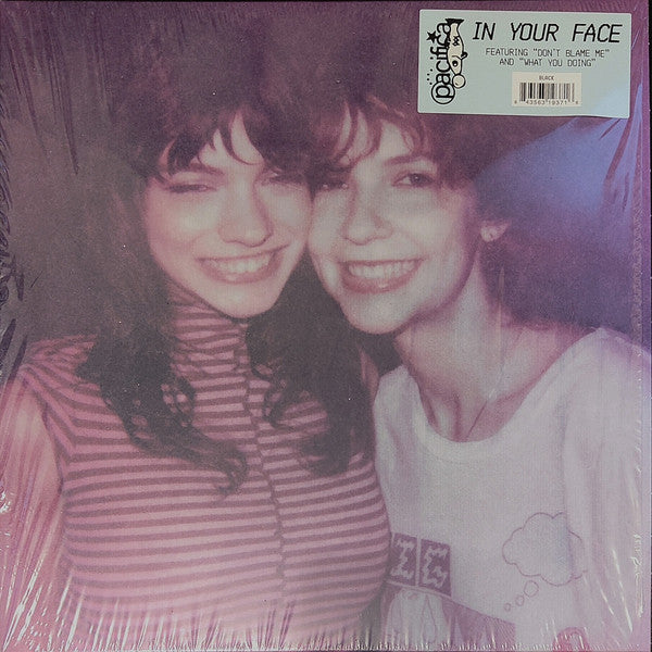Vinyl record cover featuring a photo of two smiling women.