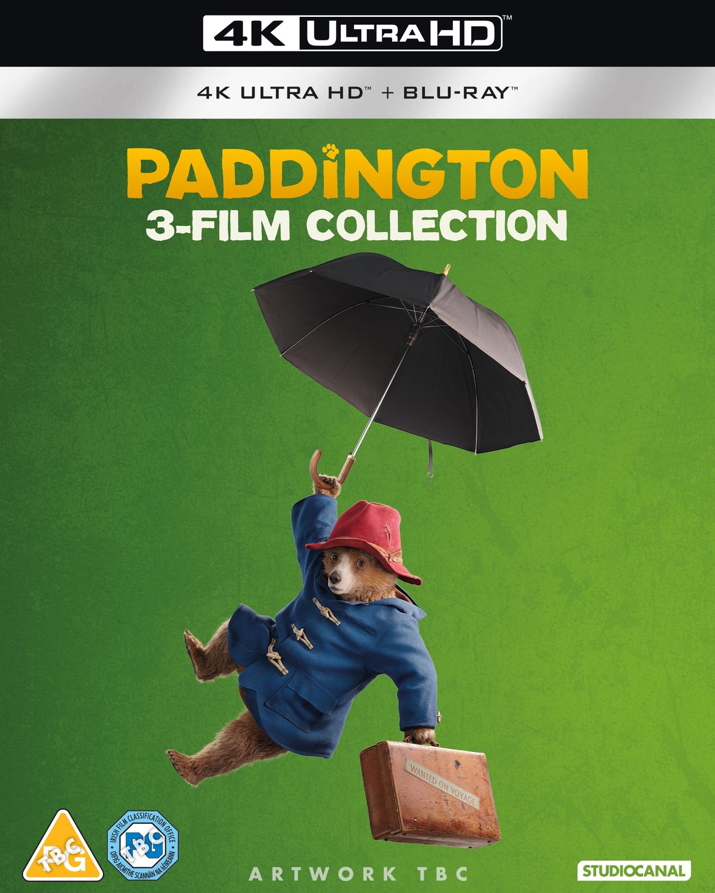 Paddington bear with suitcase, floating under umbrella on Blu-ray cover.