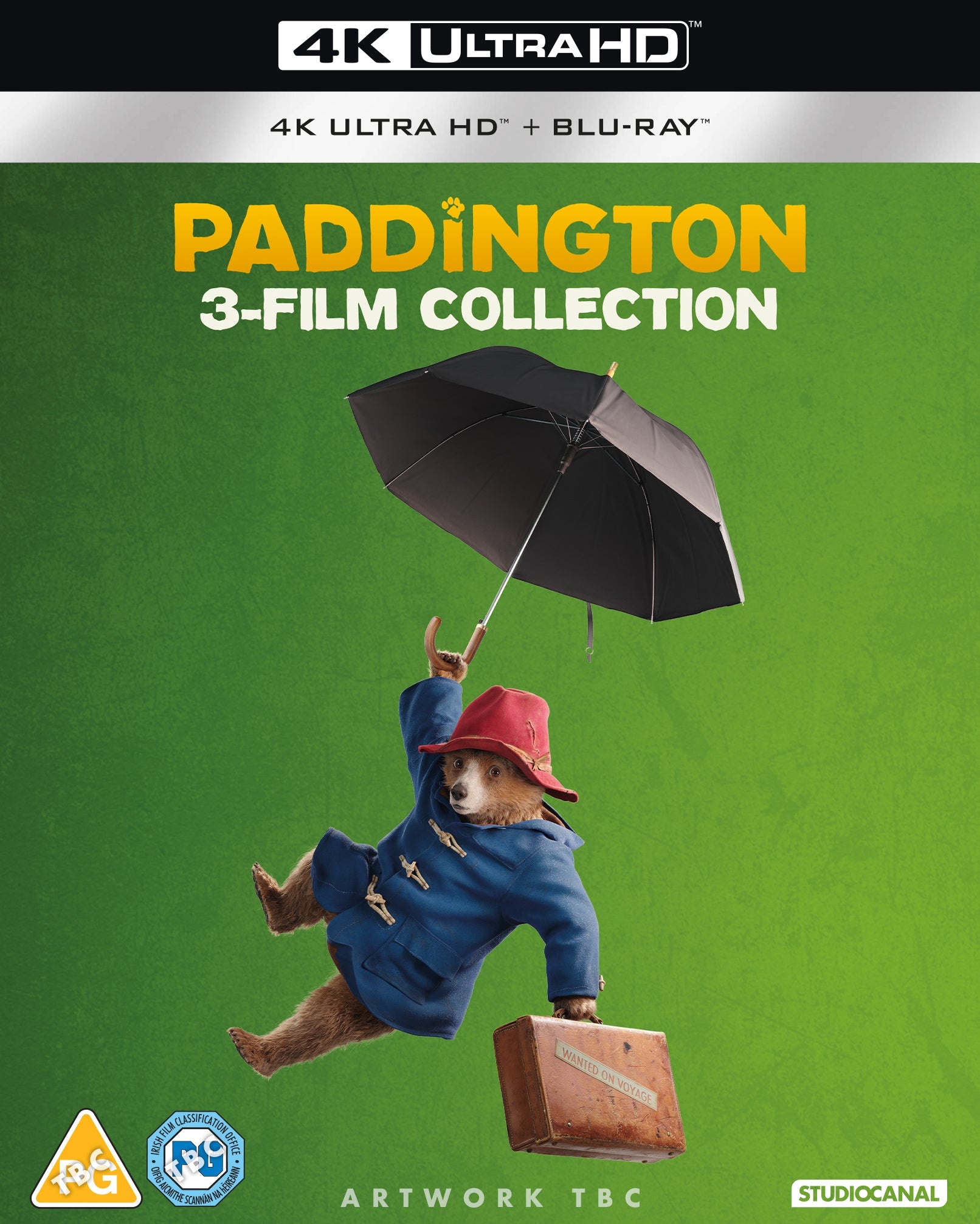 Paddington bear with suitcase, floating under umbrella on Blu-ray cover.
