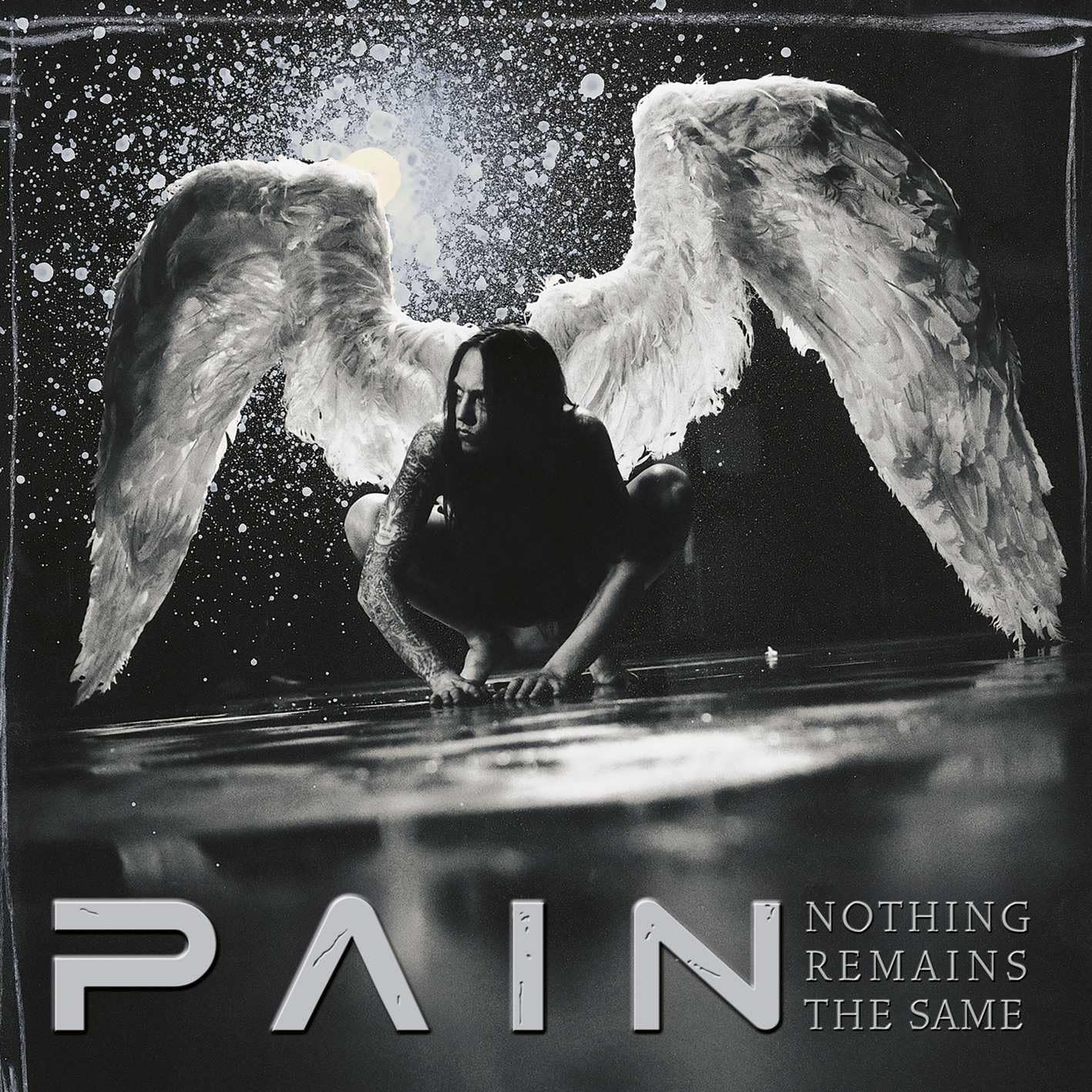 Black and white album cover featuring a person with large, feathered wings.
