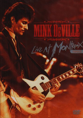 DVD cover featuring Mink DeVille playing a white guitar on stage with red background.