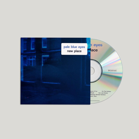 CD for "Pale Blue Eyes - New Place" with blurry blue cityscape.