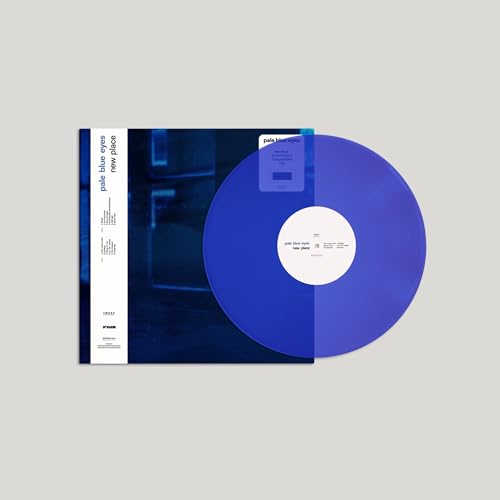 Transparent blue vinyl record with album cover showing a nighttime scene.