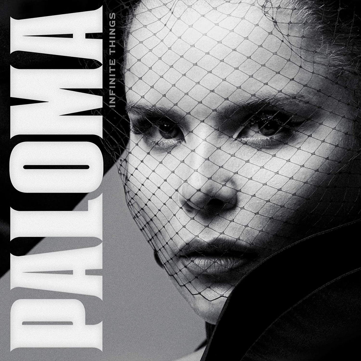 "Album cover featuring a black-and-white portrait of a woman behind a mesh veil."