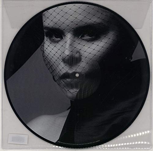 Black and white vinyl record featuring Paloma Faith with a veiled face.