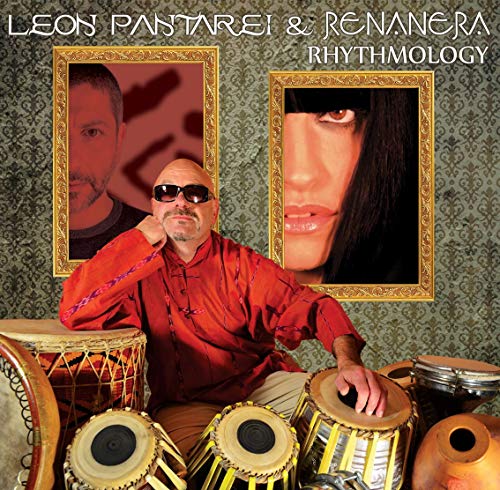 CD cover featuring three men, percussion instruments, and framed portraits.
