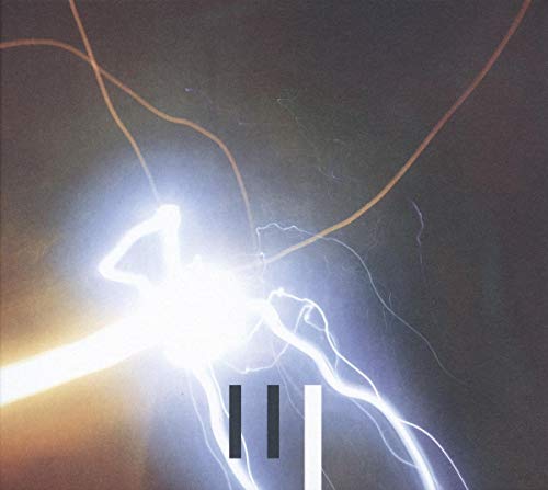 Album cover for Pantha Du Prince’s “The Triad” featuring abstract light trails.