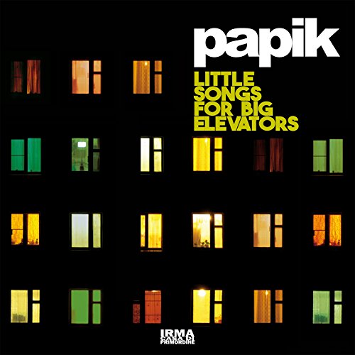 CD cover: dark building facade with illuminated windows, text "papik".