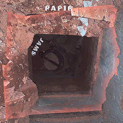 Vinyl record album cover for Papir - Jams, viewed through a brick opening.