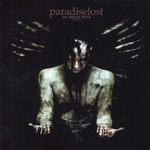 CD cover: dark, winged figure with pale skin and outstretched hands.