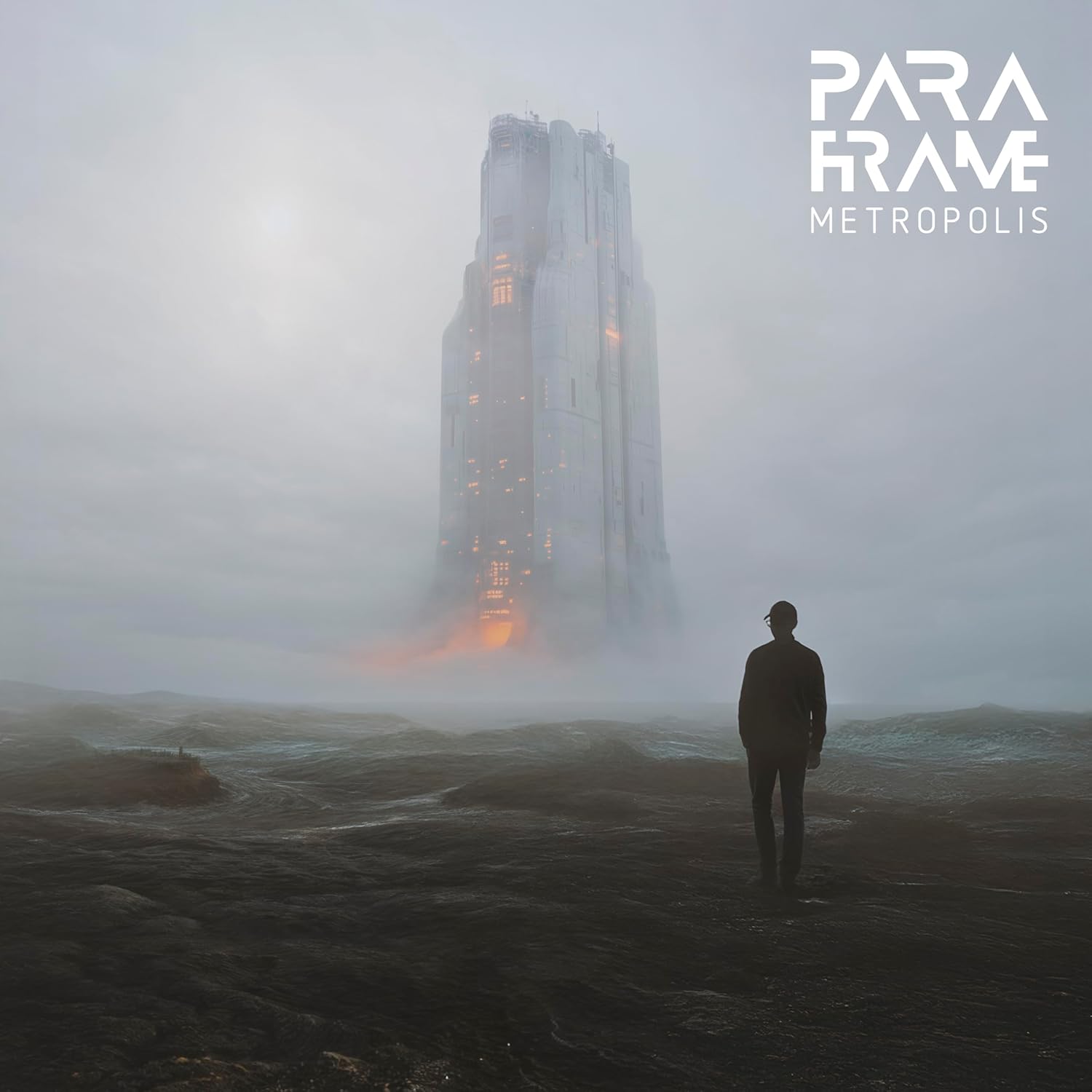 Silhouette of a person facing a tall, misty building.