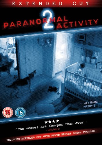 Paranormal Activity 2" DVD cover featuring a dimly lit bedroom and dogs.