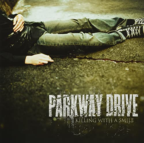 Person lying on asphalt with album title “Parkway Drive” overlaid.