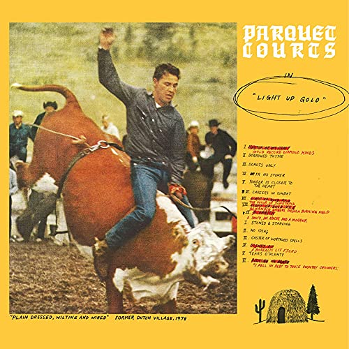 Vinyl record cover: cowboy riding a bull, yellow background, text listing songs.