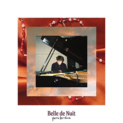 CD cover: person at a piano framed by red beads and color.