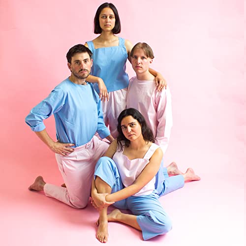 Four people wearing blue and pink outfits pose together against a solid pink background.