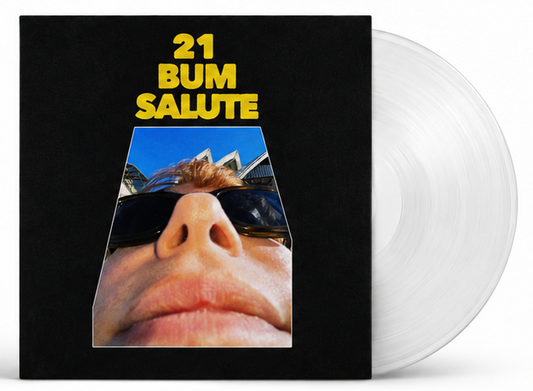 Vinyl record with album cover featuring a close-up face and city scene.