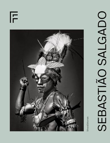 Black and white portrait of an Indigenous man with feathered headdress.