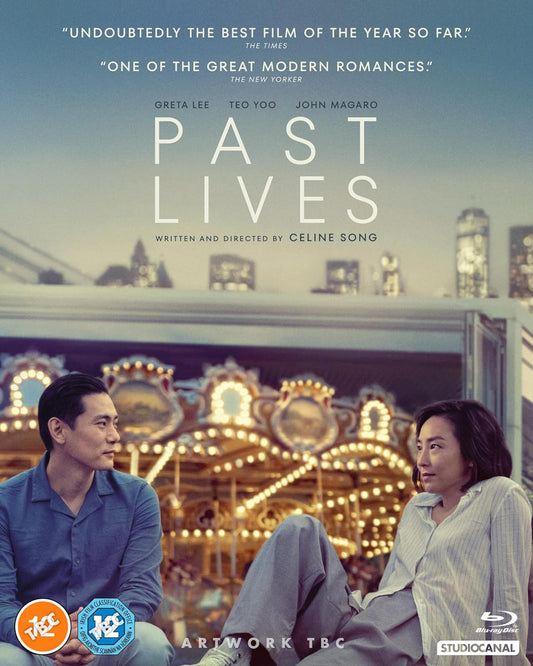 Blu-ray cover for Past Lives featuring a man and woman sitting before a carousel.