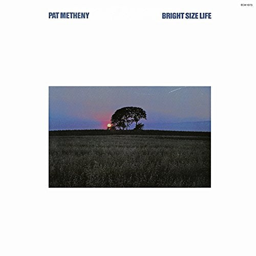 Album cover: field with trees silhouetted against a dusky sky.