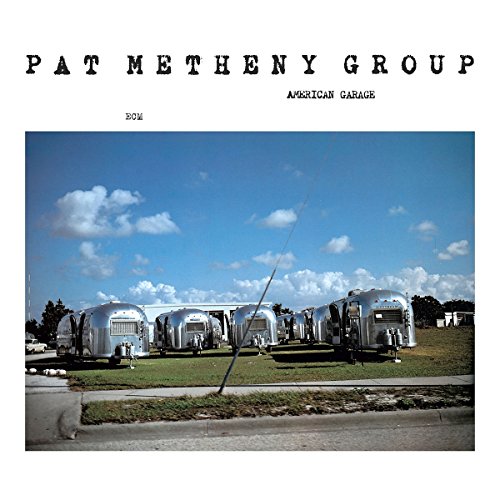 "Album cover with photo of silver garages and blue sky, titled 'Pat Metheny Group - American Garage'."