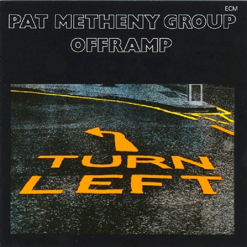 "Album cover with 'TURN LEFT' text on a road, black background, white and yellow text."