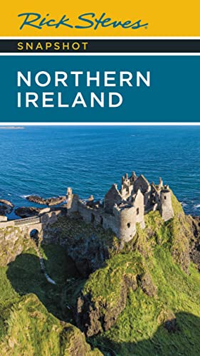 Rick Steves travel guide cover featuring Dunluce Castle on the coast.