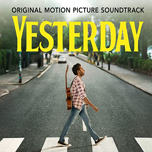 Yesterday" vinyl record cover featuring a man with a guitar on a street.