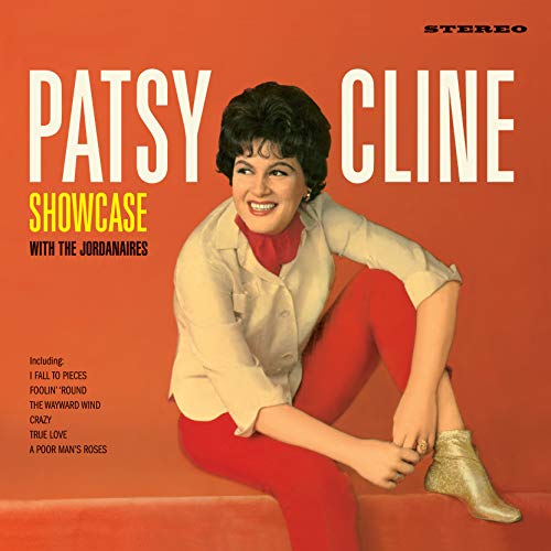 Patsy Cline album cover, orange background, smiling woman in a seated pose.