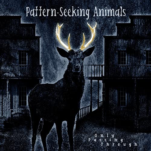 Dark album cover featuring a deer with glowing antlers in front of houses.