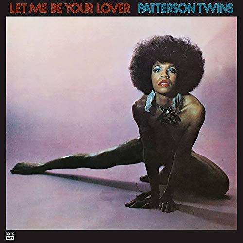 Album cover: Patterson Twins, woman with large afro, seated pose.